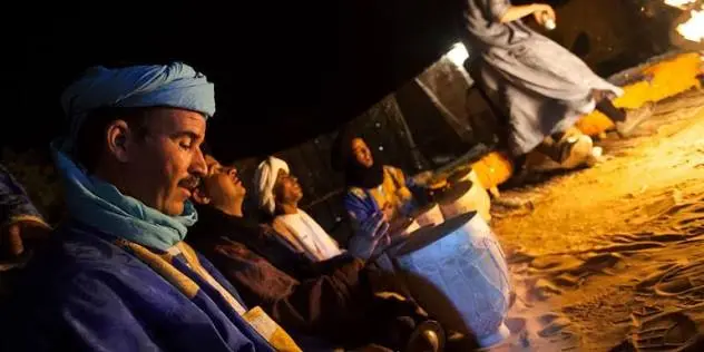 Moroccan men in conversation, reflecting the languages spoken in Morocco