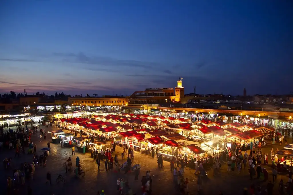 Food stalls lit up at dusk in Jemaa el-Fnaa square, Marrakech
