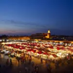 Food stalls lit up at dusk in Jemaa el-Fnaa square, Marrakech