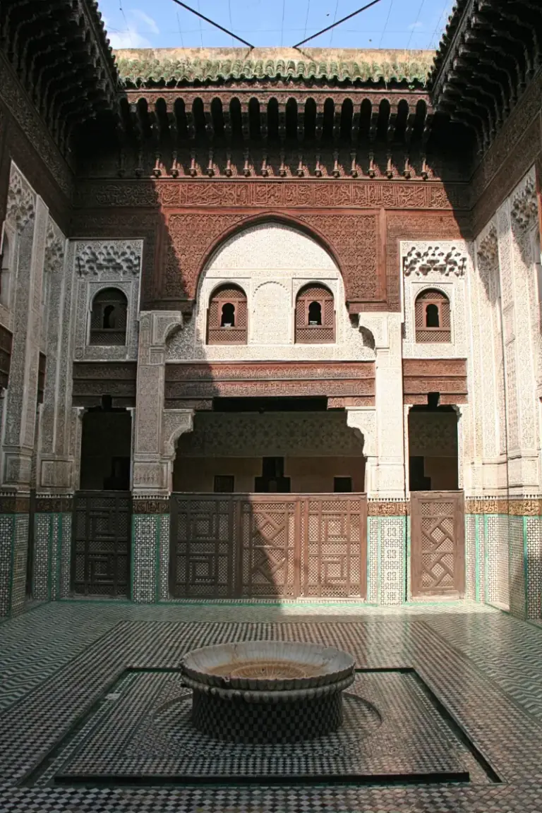 Carved cedar and tilework in the courtyard of the Bou Inania madrasa in Meknes