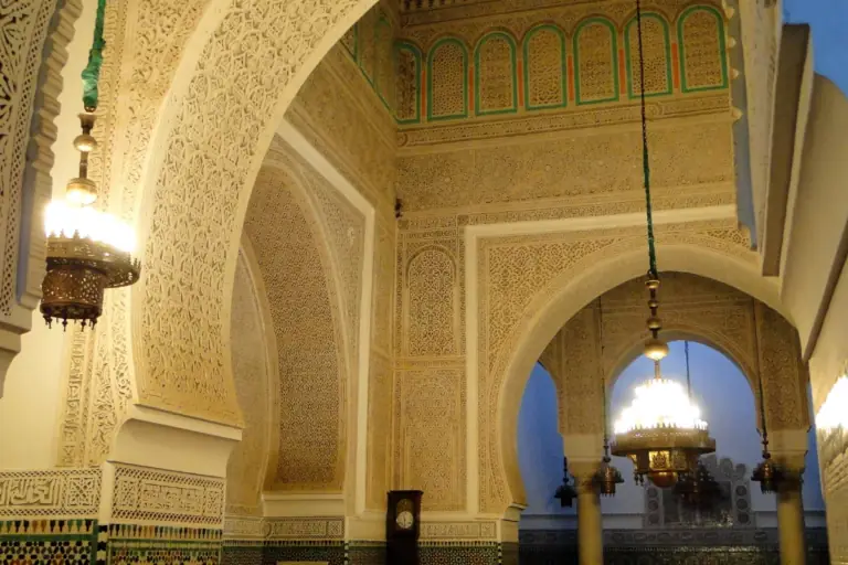 Lanterns and carved stucco inside the Mausoleum of Moulay Ismail in Meknes