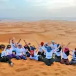 Morocco student tours: a school group on the Erg Chebbi dunes in the Sahara